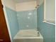 Bathroom with a tiled tub and shower combination at 1713 S Garnett St, Henderson, NC 27536