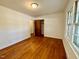 Neutral bedroom offers hardwood floors, a closet, and a ceiling light at 1713 S Garnett St, Henderson, NC 27536