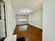 Bright living room showcasing hardwood floors, neutral walls, and natural light from a window at 1713 S Garnett St, Henderson, NC 27536