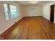 Bright, freshly painted living room featuring hardwood floors and bright windows at 1713 S Garnett St, Henderson, NC 27536
