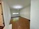 Bright living room featuring hardwood floors, neutral paint, and natural light from windows at 1713 S Garnett St, Henderson, NC 27536