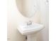 Bathroom featuring a pedestal sink, oval mirror, and chrome fixtures at 172 Token House Rd, Durham, NC 27703