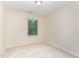 Bright and airy bedroom with a window offering natural light and neutral carpet at 172 Token House Rd, Durham, NC 27703