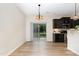 Dining area with access to the backyard, adjacent to the kitchen featuring stainless steel appliances at 172 Token House Rd, Durham, NC 27703