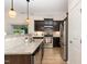 Gourmet kitchen features stainless steel appliances, granite counters, and dark wood cabinetry at 172 Token House Rd, Durham, NC 27703
