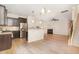 Open-concept living space featuring a kitchen with granite countertops and stainless steel appliances at 172 Token House Rd, Durham, NC 27703