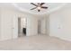 Bedroom with a ceiling fan and connecting to ensuite bathroom and walk-in closets at 172 Token House Rd, Durham, NC 27703