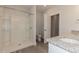 Bathroom with a walk-in shower, granite counters, and wood-look flooring at 1739 Old Fields Blvd, Haw River, NC 27258