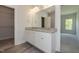 Bathroom featuring double sinks, granite counters, and a walk-in closet at 1739 Old Fields Blvd, Haw River, NC 27258