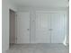Bedroom has neutral carpet, base trim, and two closets with double doors at 1739 Old Fields Blvd, Haw River, NC 27258