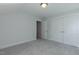 Bright bedroom features neutral carpet, light walls, and a double-door closet at 1739 Old Fields Blvd, Haw River, NC 27258