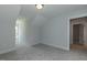 Bright bedroom with neutral carpet, light walls, and a doorway leading to another room at 1739 Old Fields Blvd, Haw River, NC 27258