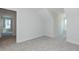 Spacious bedroom features neutral carpet, light walls, and a doorway to another room at 1739 Old Fields Blvd, Haw River, NC 27258