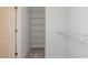 Walk-in closet with white wire shelving at 1739 Old Fields Blvd, Haw River, NC 27258