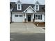 Charming new construction with white siding, a one car garage, and a concrete driveway at 1739 Old Fields Blvd, Haw River, NC 27258