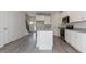 Bright kitchen with an island with granite countertops, stainless steel appliances, and an open floorplan at 1739 Old Fields Blvd, Haw River, NC 27258