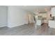 Open concept living area featuring an eat-in kitchen with white cabinets and granite counters at 1739 Old Fields Blvd, Haw River, NC 27258