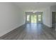 Inviting living room with a fan, recessed lights, large windows, and neutral paint at 1739 Old Fields Blvd, Haw River, NC 27258