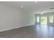 Bright living room featuring recessed lighting, neutral paint, ceiling fan, and sliding glass doors at 1739 Old Fields Blvd, Haw River, NC 27258
