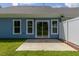 Outdoor patio with sliding glass doors providing a smooth transition to the home's interior at 1739 Old Fields Blvd, Haw River, NC 27258
