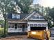 Charming home under construction featuring a classic roofline and an attached garage at 218 Oakdale Ave, Clayton, NC 27520