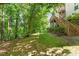 Backyard with wooden stairway and tree lined property at 2201 Mountain Mist Ct # 202, Raleigh, NC 27603