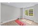 Bright bonus room with hardwood floors, large window, and neutral paint, perfect for a home gym at 2201 Mountain Mist Ct # 202, Raleigh, NC 27603