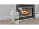 Close up of the fireplace in the living room with white orchid centerpiece at 2201 Mountain Mist Ct # 202, Raleigh, NC 27603