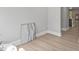 Hallway featuring updated flooring and access to multiple rooms at 2201 Mountain Mist Ct # 202, Raleigh, NC 27603