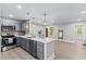 Modern kitchen with stainless steel appliances, ample counter space, and stylish gray cabinets at 2201 Mountain Mist Ct # 202, Raleigh, NC 27603