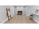 Living room featuring a fireplace, wood floors, and natural light at 2201 Mountain Mist Ct # 202, Raleigh, NC 27603
