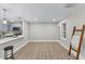 Open living area with light wood floors, natural light, and view to the kitchen at 2201 Mountain Mist Ct # 202, Raleigh, NC 27603