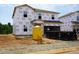 New construction home with Tyvek wrap, portable toilet, and dumpster at 2234 Cherry Creek Rd, Haw River, NC 27258
