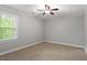 Bedroom with carpet and a window at 2300 Cowden Ct, Raleigh, NC 27612