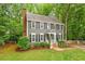 Charming two-story home with gray siding, black shutters and a well-manicured lawn at 2300 Cowden Ct, Raleigh, NC 27612