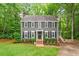 Charming two-story home with a well-maintained lawn and mature trees at 2300 Cowden Ct, Raleigh, NC 27612