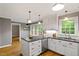 Open kitchen area, featuring stainless appliances and hardwood floors at 2300 Cowden Ct, Raleigh, NC 27612