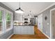 Bright kitchen featuring stainless appliances, gray countertops, and ample storage at 2300 Cowden Ct, Raleigh, NC 27612