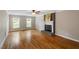 Hardwood floors and a brick fireplace accent the living room at 2300 Cowden Ct, Raleigh, NC 27612
