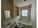 Compact bathroom with a tub and shower combo, vanity with sink, and toilet at 246 Keene St, Henderson, NC 27536