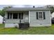 Quaint single-story home featuring horizontal siding and an inviting front entrance at 246 Keene St, Henderson, NC 27536