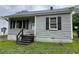 Quaint single-story home featuring horizontal siding and an inviting front entrance at 246 Keene St, Henderson, NC 27536