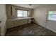 Functional kitchen featuring white cabinetry, laminate counters and a double sink at 246 Keene St, Henderson, NC 27536