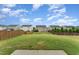 A spacious backyard is surrounded by a wooden fence at 2530 Girvan Dr, Fuquay Varina, NC 27526