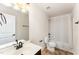 Clean bathroom featuring a shower with a tub, toilet, vanity, and large mirror at 2530 Girvan Dr, Fuquay Varina, NC 27526