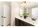 Bathroom features double vanity, modern fixtures, and an open doorway at 2530 Girvan Dr, Fuquay Varina, NC 27526