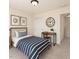 Cozy bedroom with a bed, desk, and decorative wall art at 2530 Girvan Dr, Fuquay Varina, NC 27526