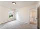 Neutral bedroom with a window, closet, and carpet flooring at 2530 Girvan Dr, Fuquay Varina, NC 27526
