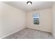 Bright bedroom features neutral carpet, cream-colored walls and a window at 2530 Girvan Dr, Fuquay Varina, NC 27526