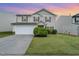 Charming two-story home with a manicured lawn and a two car garage at 2530 Girvan Dr, Fuquay Varina, NC 27526